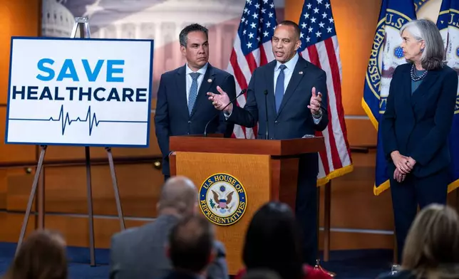 House Minority Leader Hakeem Jeffries, D-N.Y., flanked by Rep. Pete Aguilar, D-Calif., left, and Rep. Katherine Clark, D-Mass., speaks during a news conference on day 22 of the government shutdown to discuss its impact on health care, at the Capitol in Washington, Wednesday, Oct. 22, 2025. (AP Photo/J. Scott Applewhite)