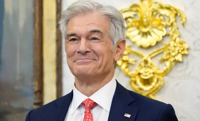 Centers for Medicare &amp; Medicaid Services administrator Dr. Mehmet Oz listens as President Donald Trump speaks in the Oval Office of the White House, Thursday, Oct. 16, 2025, in Washington. (AP Photo/Alex Brandon)