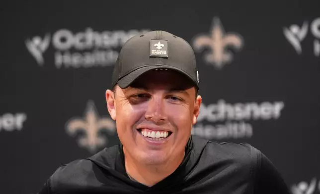 New Orleans Saints head coach Kellen Moore talks to reporters after an NFL football game against the New York Giants in New Orleans, Sunday, Oct. 5, 2025. (AP Photo/Gerald Herbert)
