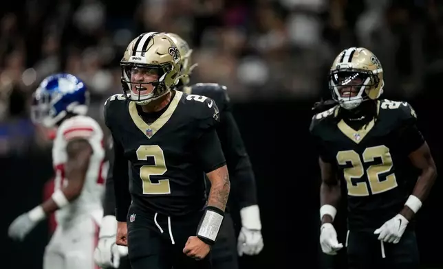 New Orleans Saints quarterback Spencer Rattler (2) celebrates a touchdown against the New York Giants in the first half of an NFL football game, Sunday, Oct. 5, 2025, in New Orleans. (AP Photo/Gerald Herbert)