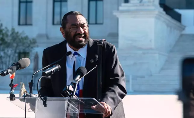 Rep. Al Green, D-Texas, speaks to voting rights activists outside the Supreme Court in Washington, early Wednesday, Oct. 15, 2025, as the justices prepare to take up a major Republican-led challenge to the Voting Rights Act, the centerpiece legislation of the Civil Rights Movement. (AP Photo/Cliff Owen)