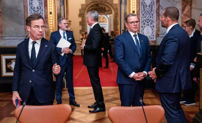 Sweden's Prime Minister, Ulf Kristersson, left, Finland's Prime Minister, Petteri Orpo, second from right, and Malta's Prime Minister, Robert Abela at the Danish parliament at Christiansborg Castle in Copenhagen as Denmark is hosting an informal summit for the EUs heads of state and government, Wednesday, Oct. 1, 2025 . (Ida Marie Odgaard/Ritzau Scanpix via AP)