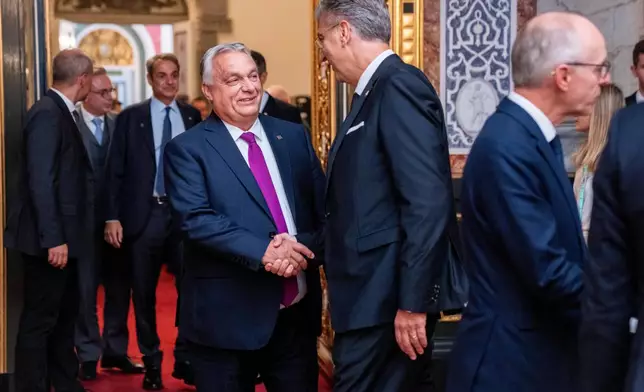 Hungary's Prime Minister, Viktor Orban, left, and Croatia's Prime Minister, Andrej Plenkovicthe shake hands at the Danish parliament at Christiansborg Castle in Copenhagen as Denmark is hosting an informal summit for the EUs heads of state and government, Wednesday, Oct. 1, 2025 . (Ida Marie Odgaard/Ritzau Scanpix via AP)