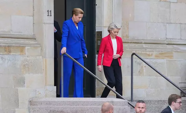 Denmark's Prime Minister Mette Frederiksen, left, and President of the European Commission, Ursula von der Leyen leave the Prime Minister's office in the Danish Parliament at Christiansborg Castle in Copenhagen, on Wednesday, Oct. 1, 2025. (Thomas Traasdahl/Ritzau Scanpix via AP)