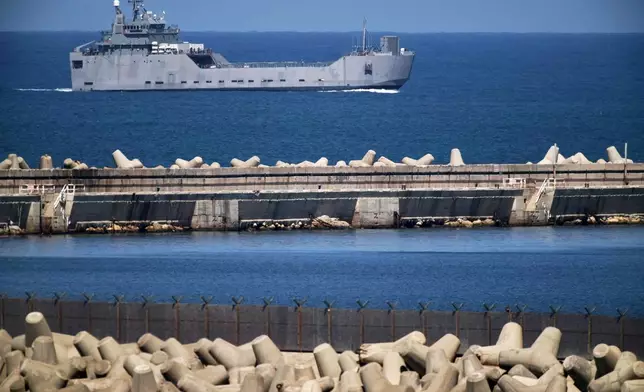 An Israeli Navy vessel moves in the Mediterranean sea toward the port of Ashdod, Israel, Thursday, Oct. 2, 2025. (AP Photo/Leo Correa)