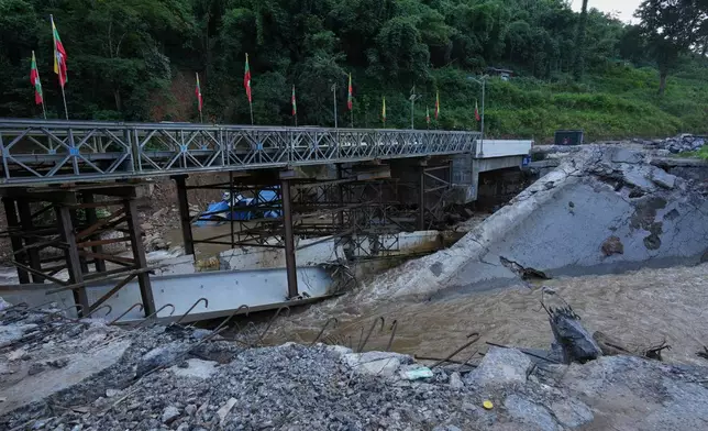 In this photo taken during a trip supervised by pro-military Myanmar media, the damaged Gotwin bridge is seen in Kawnghkio township, northern Shan State, Myanmar, Friday, Oct. 10, 2025. (AP Photo/Aung Shine Oo)