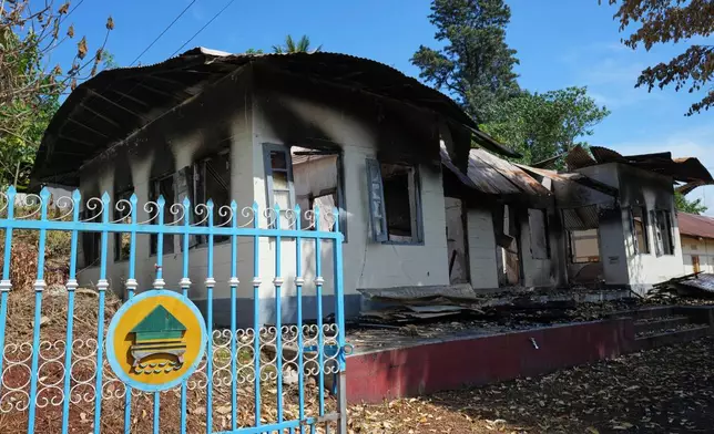 In this photo taken during a trip supervised by pro-military Myanmar media, a damaged government residence is seen in Kyaukme, northern Shan State, Myanmar, Friday, Oct. 10, 2025. (AP Photo/Aung Shine Oo)