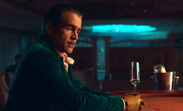 This image released by Netflix shows Colin Farrell in a scene from "Ballad of a Small Player." (Netflix via AP)
