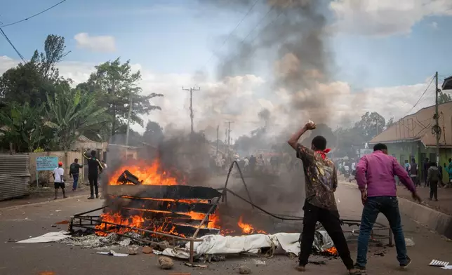 People protest in the streets of Arusha, Tanzania, on election day Wednesday, Oct. 29, 2025. (AP Photo/str)