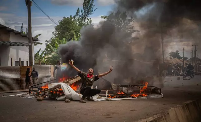 People protest in the streets of Arusha, Tanzania, on election day Wednesday, Oct. 29, 2025. (AP Photo/str)