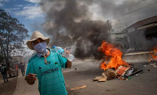 People protest in the streets of Arusha, Tanzania, on election day Wednesday, Oct. 29, 2025. (AP Photo/str)