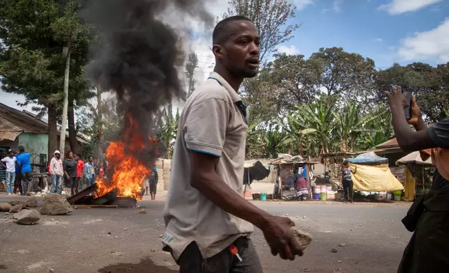 People protest in the streets of Arusha, Tanzania, on election day Wednesday, Oct. 29, 2025. (AP Photo/str)
