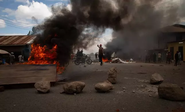 People protest in the streets of Arusha, Tanzania, on election day Wednesday, Oct. 29, 2025. (AP Photo/str)