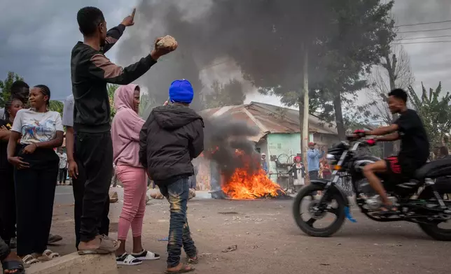 People protest in the streets of Arusha, Tanzania, on election day Wednesday, Oct. 29, 2025. (AP Photo/str)
