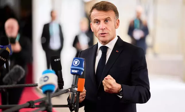 French President Emmanuel Macron arrives at an informal summit in the Danish parliament at Christiansborg Castle in Copenhagen, Wednesday, Oct. 1, 2025. (Thomas Traasdahl/Ritzau Scanpix via AP)