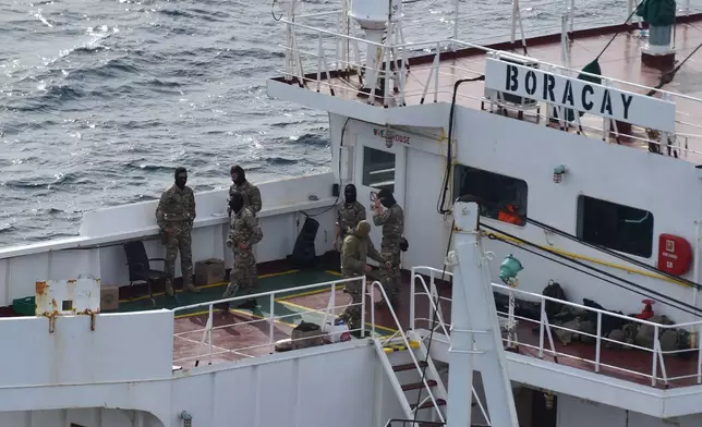 Soldiers stand on the deck on the tanker Boracay that allegedly belongs to Russia's so-called shadow fleet, Thursday, Oct. 2, 2025, off Saint-Nazaire, France's Atlantic coast. (AP Photo/Mathieu Pattier)