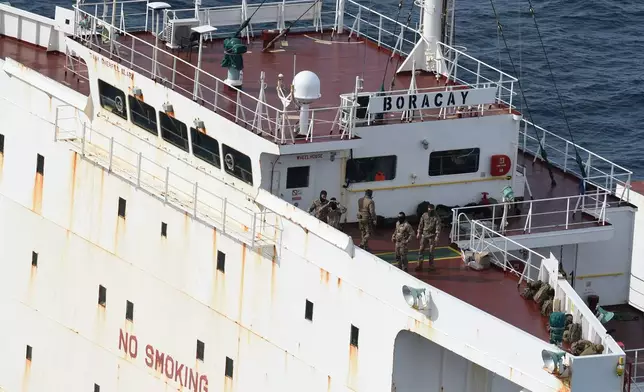 Soldiers stand on the deck on the tanker Boracay that allegedly belongs to Russia's so-called shadow fleet, Thursday, Oct. 2, 2025, off Saint-Nazaire, France's Atlantic coast. (AP Photo/Mathieu Pattier)