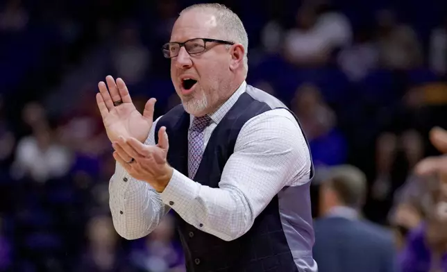 FILE - Texas A&amp;M head coach Buzz Williams reacts during the first half of an NCAA college basketball game against LSU in Baton Rouge, La., March 8, 2025. (AP Photo/Matthew Hinton, File)