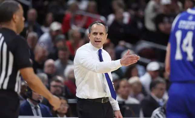 FILE - Drake head coach Ben McCollum has words with the referee during the first half against Texas Tech in the second round of the NCAA college basketball tournament, March 22, 2025, in Wichita, Kan. (AP Photo/Travis Heying, File)