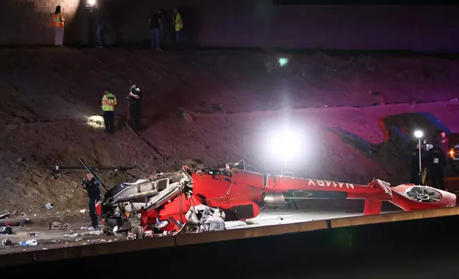 A medical helicopter is shown after it crashed on Highway 50 Monday, Oct. 6, 2025, in Sacramento, Calif. (AP Photo/Scott Marshall)