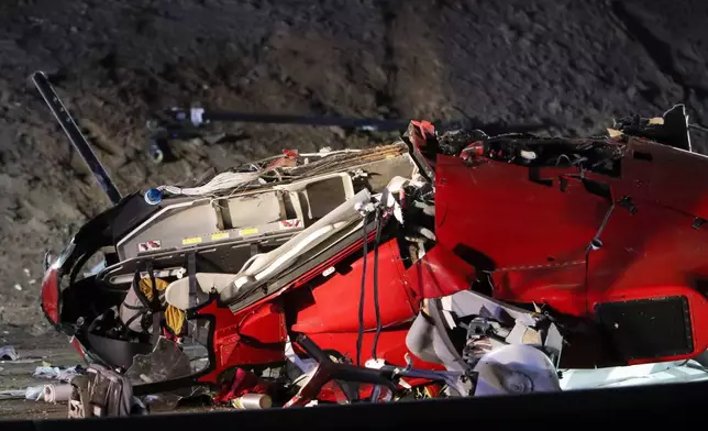 A medical helicopter is shown after it crashed on Highway 50 Monday, Oct. 6, 2025, in Sacramento, Calif. (AP Photo/Scott Marshall)