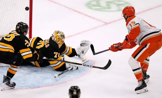Anaheim Ducks right wing Troy Terry (19) scores on Boston Bruins goaltender Joonas Korpisalo (70), breaking a 3-3 tie, during the third period of an NHL hockey game, Thursday, Oct. 23, 2025, in Boston. (AP Photo/Charles Krupa)