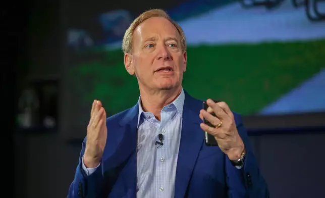 Microsoft Vice Chair and President Brad Smith speaks about the company's initiative to increase access to AI software and training for teachers and students across Washington on Thursday, Oct. 9, 2025 at the company's headquarters in Redmond, Wash. (AP Photo/Cedar Attanasio)