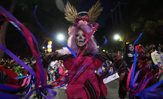 Drag artist Angel Arumir takes part in the annual Day of the Dead Catrina parade in Mexico City, Sunday, Oct. 26, 2025. (AP Photo/Claudia Rosel)