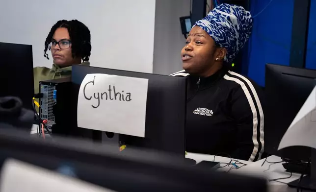 Students attend a Per Scholas class at the training center's Brooklyn campus, Monday, Oct. 20, 2025, in New York. (AP Photo/Angelina Katsanis)