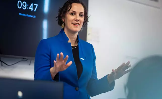 Caitlyn Brazill, President of Per Scholas, speaks to a Per Scholas class at the training center's Brooklyn Campus, Monday, Oct. 20, 2025, in New York. (AP Photo/Angelina Katsanis)