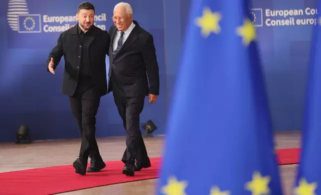 Ukraine's President Volodymyr Zelenskyy, left, and European Council President Antonio Costa arrive for an EU Summit at the European Council building in Brussels, Thursday, Oct. 23, 2025. (AP Photo/Francois Walschaerts)