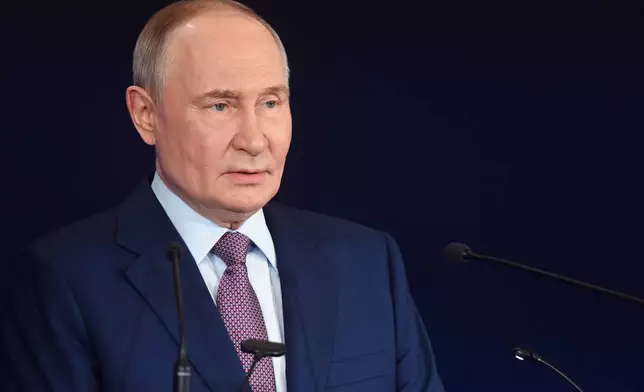 Russian President Vladimir Putin speaks at the Russian Geographical Society congress at the State Kremlin Palace in Moscow, Russia, Thursday, Oct. 23, 2025. (Kristina Kormilitsyna, Sputnik, Kremlin Pool Photo via AP)