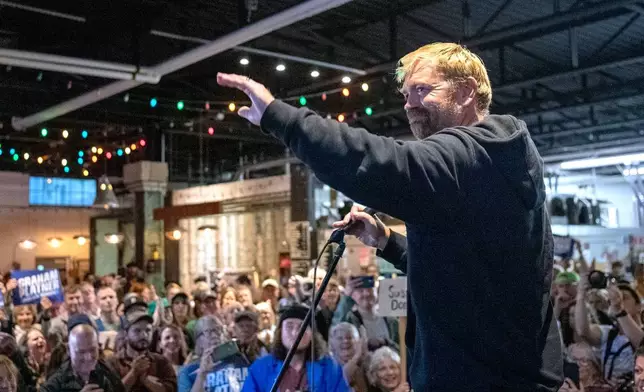 Senate candidate Graham Platner acknowledges the large crowd that attended Platner's town hall, Sept. 25, 2025, at Bunker Brewing in Portland, Maine. (Daryn Slover/Portland Press Herald via AP)