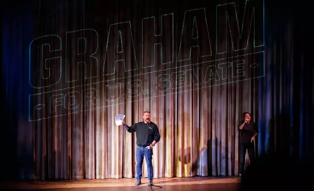 Democratic Maine Senate candidate Graham Platner speaks at a town hall in Ogunquit, Maine, Wednesday, Oct. 22, 2025. (AP Photo/Caleb Jones)