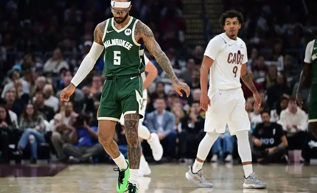 Milwaukee Bucks guard Gary Trent Jr. (5) reacts after a shot clock violation in the first half of an NBA basketball game against the Cleveland Cavaliers, Sunday, Oct. 26, 2025, in Cleveland. (AP Photo/David Dermer)
