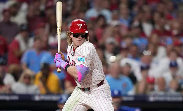Philadelphia Phillies' Harrison Bader is hit by a pitch from Los Angeles Dodgers' Shohei Ohtani during the fifth inning in Game 1 of baseball's National League Division Series, Saturday, Oct. 4, 2025, in Philadelphia. (AP Photo/Matt Slocum)