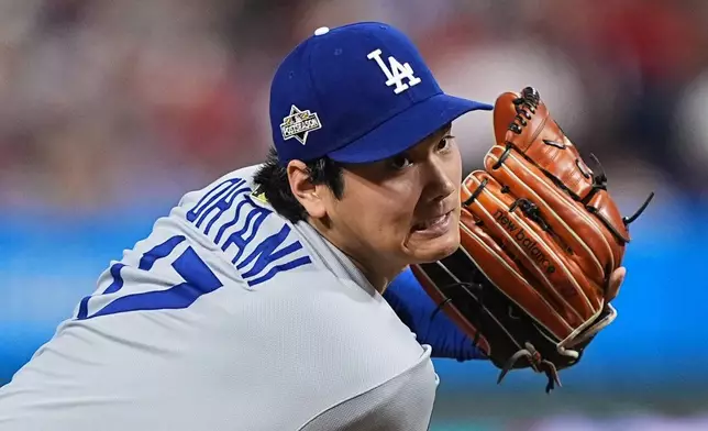 Los Angeles Dodgers' Shohei Ohtani pitches during the second inning in Game 1 of baseball's National League Division Series against the against the Philadelphia Phillies Saturday, Oct. 4, 2025, in Philadelphia. (AP Photo/Matt Rourke)