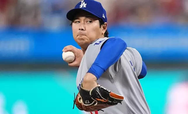 Los Angeles Dodgers' Shohei Ohtani pitches during the second inning in Game 1 of baseball's National League Division Series against the against the Philadelphia Phillies Saturday, Oct. 4, 2025, in Philadelphia. (AP Photo/Matt Rourke)