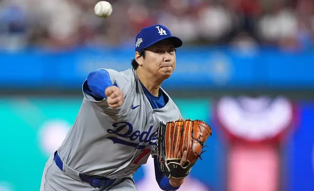 Los Angeles Dodgers' Shohei Ohtani pitches during the second inning in Game 1 of baseball's National League Division Series against the against the Philadelphia Phillies Saturday, Oct. 4, 2025, in Philadelphia. (AP Photo/Matt Rourke)