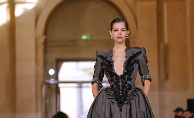 A model wears a creation as part of the Vivienne Westwood Spring/Summer 2026 collection presented in Paris, Saturday, Oct. 4, 2025. (AP Photo/Aurelien Morissard)