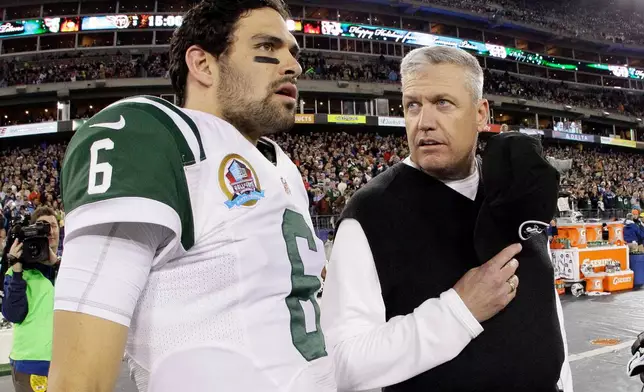 FILE - New York Jets head coach Rex Ryan, right, talks with quarterback Mark Sanchez (6) before an NFL football game between the Tennessee Titans and the New York Jets on Monday, Dec. 17, 2012, in Nashville, Tenn. (AP Photo/Wade Payne, File)