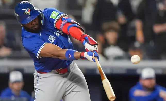 Toronto Blue Jays' Vladimir Guerrero Jr. connects for a single to drive in a run against the New York Yankees during the first inning of Game 4 of baseball's American League Division Series, Wednesday, Oct. 8, 2025, in New York. (AP Photo/Frank Franklin II)