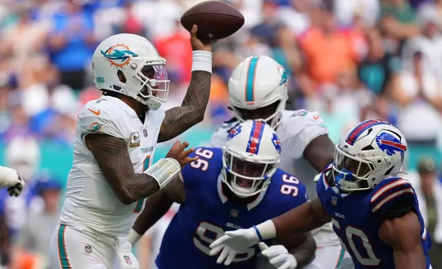 Miami Dolphins quarterback Tua Tagovailoa throws during the first half of an NFL football game against the Buffalo Bills, Sunday, Nov. 9, 2025, in Miami Gardens, Fla. (AP Photo/Rebecca Blackwell)