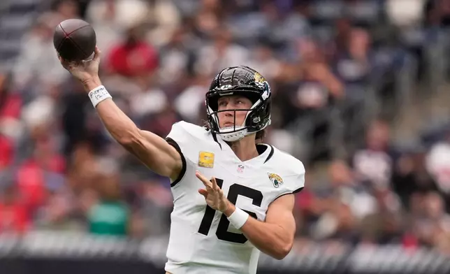 Jacksonville Jaguars quarterback Trevor Lawrence (16) throws during an NFL football game against the Houston Texans, Sunday, Nov. 9, 2025, in Houston. (AP Photo/Eric Christian Smith)