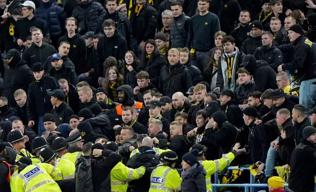 Young Boys' fans cause trouble during the Europa League soccer match between Aston Villa and Young Boys in Birmingham, England, Thursday, Nov. 27, 2025. (Joe Giddens/PA via AP)