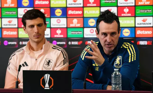 Aston Villa manager Unai Emery with Pau Torres, left, during a press conference at Bodymoor Heath Training Ground, Birmingham, England, Wednesday Nov. 26, 2025. (Jacob King/PA via AP)