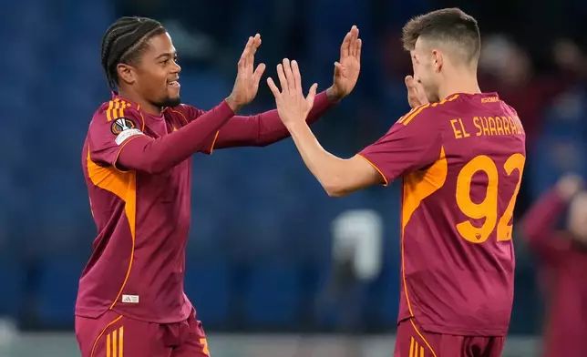 Roma's Stephan El Shaarawy, right, celebrates after scoring with teammates Roma's Leon Bailey during the Europa League opening phase soccer match between Roma and Midtjylland in Rome, Italy Thursday, Nov. 27, 2025. (AP Photo/Gregorio Borgia)