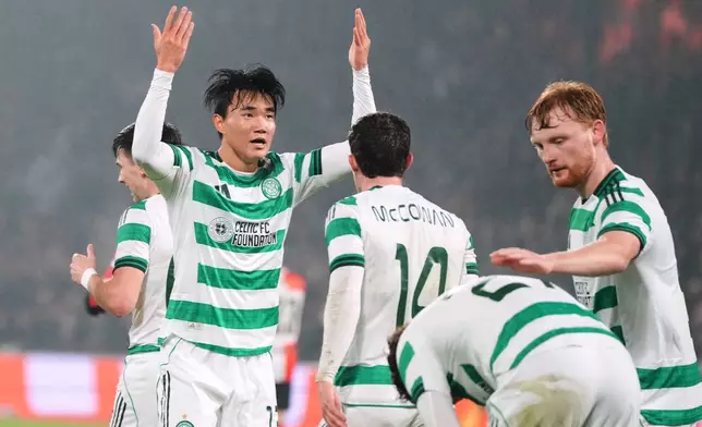 Celtic's Yang Hyun-jun celebrates scoring his side's first goal during the Europa League opening phase soccer match between Feyenoord and Celtic in Rotterdam, Netherlands, Thursday, Nov. 27, 2025. (AP Photo/Peter Dejong)