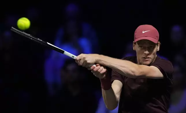 Italy's Jannik Sinner returns to Canada's Felix Auger-Aliassime during the final match of the Paris Masters tennis tournament in Paris, Sunday, Nov. 2, 2025. (AP Photo/Christophe Ena)