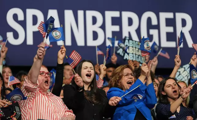 People cheer as Democrat Abigail Spanberger speaks on stage after she was declared the winner of the Virginia governor's race during an election night watch party Tuesday, Nov. 4, 2025, in Richmond, Va. (AP Photo/Stephanie Scarbrough)